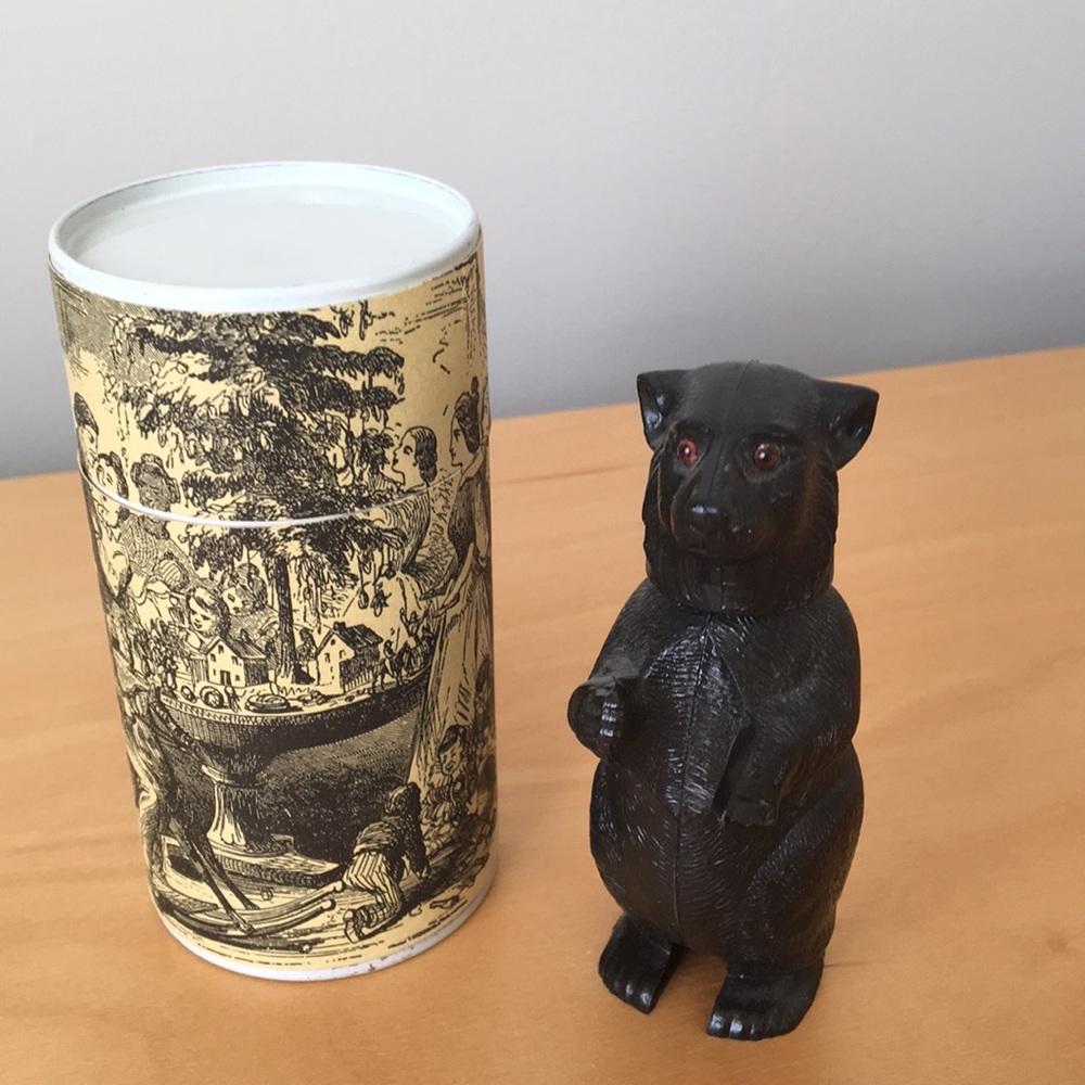 Wobble-head bear with an ornate gift box